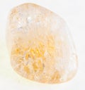 tumbled Citrine (yellow quartz) gemstone on white