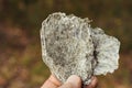 Macro photography of unprocessed pieces of mica minerals in a natural deposit