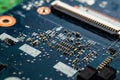 Close-up printed circuit board with electronics components. Macro photography for electric background. PCB with microchip, process