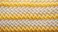 Macro photography of the texture of a knitted pattern in close-up, white and yellow colors, warm clothes Royalty Free Stock Photo