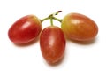 Macro Photography of Three Red Grapes, isolated on white Royalty Free Stock Photo