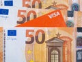 Macro picture of a 50 Euro Banknote and a Visa debit or credit card. European Currency Concept