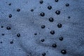 picture of some water drops on a black leather surface Royalty Free Stock Photo