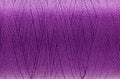 Macro picture of thread texture violet color background