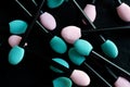 Macro of Pink and Aqua Women Makeup Applicators on Black Background Royalty Free Stock Photo