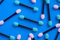 Macro of Pink and Aqua Women Makeup Applicators on Blue Background Royalty Free Stock Photo
