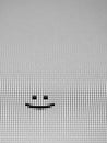 B&W MACRO: Pixel level smiley face symbol