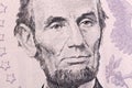 Macro portrait of Abraham Lincoln on five U.S. dollar bill. Royalty Free Stock Photo
