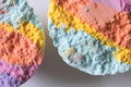 Macro rainbow bath bombs on white background