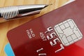 Macro of a Red Credit Card with a pen Royalty Free Stock Photo