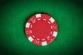 Macro red poker chip on green table Royalty Free Stock Photo