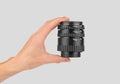 Macro rings for a camera in a male hand on a gray background Royalty Free Stock Photo