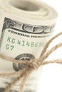 Macro Roll of One Hundred Dollar Bills Tied in Burlap String on White Royalty Free Stock Photo