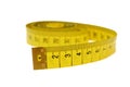 Macro of rolled yellow measure tape Royalty Free Stock Photo