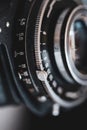 Macro and shallow depth of field image selective focus with the markings on the lens of a very old bellows photo camera Royalty Free Stock Photo