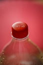 Macro shallow depth of field image selective focus with the plastic bottle cap of a Coca Cola bottle