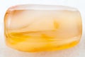 bead from yellow Agate gemstone on white Royalty Free Stock Photo