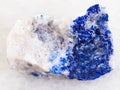 lapis lazuli stone on white marble Royalty Free Stock Photo