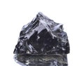 Macro shooting of natural mineral rock specimen - obsidian, stone on an isolated white background