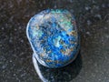 pebble of Azurite gemstone on dark