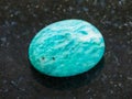 polished amazonite gemstone (amazon stone) on dark