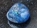 polished Azurite gemstone on dark background