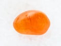 polished Carnelian gemstone on white marble