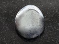 polished hematite gemstone on dark background