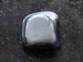 polished hematite stone on dark background