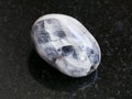 polished Tamerlane Stone (amethyst quartz) on dark