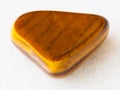 polished tiger-eye gem stone on white Royalty Free Stock Photo