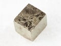 pyrite crystal on white marble
