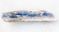 raw blue kyanite stone on white marble