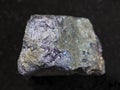 raw bornite stone on dark