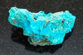 raw Chrysocolla stone on dark background