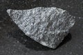 raw dolerite stone on dark background