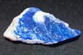 raw lazurite (lapis lazuli) stone on dark Royalty Free Stock Photo