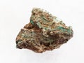 raw Malachite (copper ore) stone on white marble Royalty Free Stock Photo