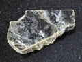 raw muscovite mica stone on dark background Royalty Free Stock Photo