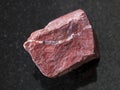 raw red jasper stone on dark background Royalty Free Stock Photo