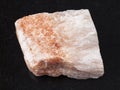 raw Selenite stone on dark background