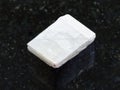 raw white calcite stone on dark background