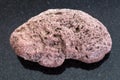 red pumice stone on dark background Royalty Free Stock Photo