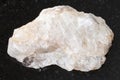 rough belomorite stone on dark background Royalty Free Stock Photo