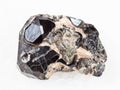 rough black crystal of Spinel gemstone on Diopside