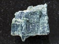 rough chrysotile asbestos stone on dark Royalty Free Stock Photo