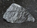 rough dolerite stone on dark background