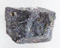 rough Molybdenite stone on white