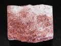 rough pink Aventurine stone on dark background
