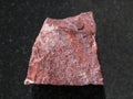 rough red jasper stone on dark background Royalty Free Stock Photo